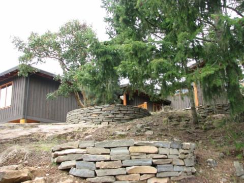 Exterior stone masonry landscaping of West Coast Home on Pender Island built by Dave Dandeneau of Gulf Islands Artisan Homes