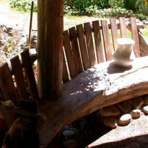 Exterior driftwood bench  on Pender Island built by Dave Dandeneau of Gulf Islands Artisan Homes